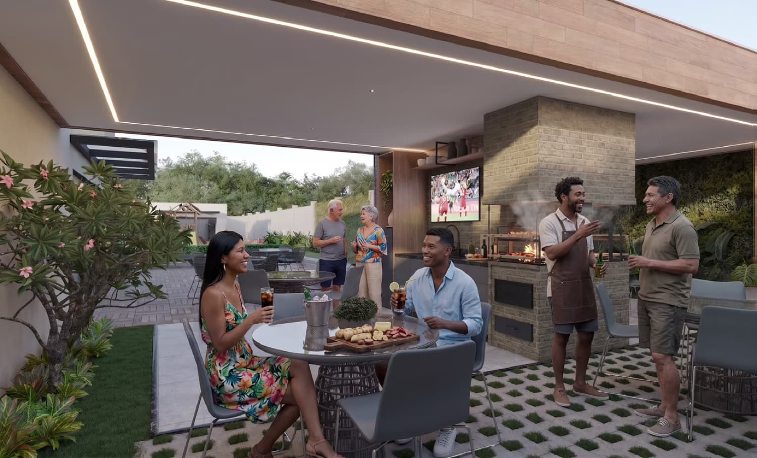 Amigos reunidos na área gourmet com duas churrasqueiras